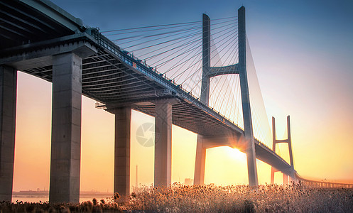 夕阳风景气势磅礴的大桥背景