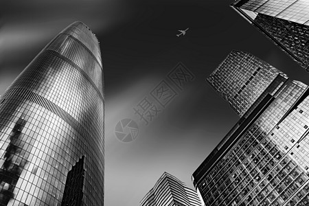 城市天空飞机CBD雄伟的黑白写字楼建筑群背景