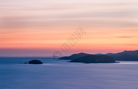 风景渐变夕阳下的海边美景背景