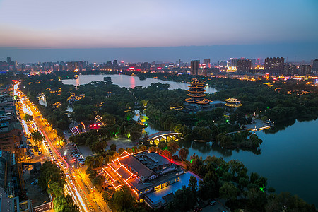 巴厘岛夜景鸟瞰济南大明湖背景