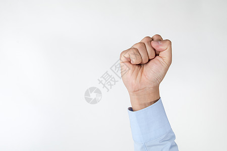 商务男士拳头紧握手势动作背景图片