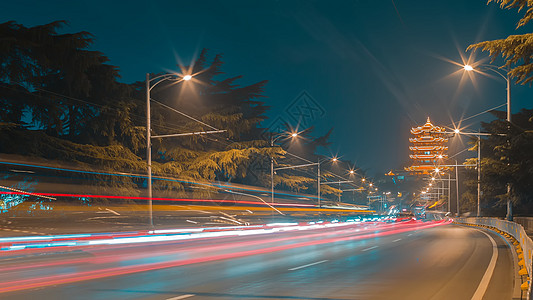 路灯街景武汉街景车轨夜景背景