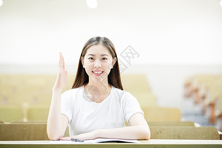 课堂上举手发言的女同学背景图片