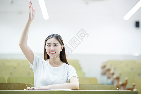 课堂上举手发言的女同学背景图片