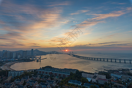 海景建筑大连星海湾日出背景