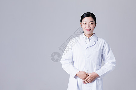 微笑护士穿白大褂的女医生形象展示棚拍背景