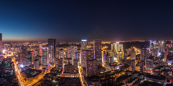 城市金钱大连东港夜景背景