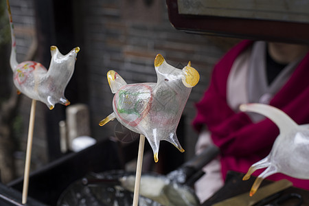 传统手工艺吹糖人背景图片