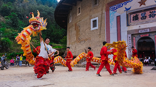 福建旅游福建南靖土楼的舞龙舞狮背景