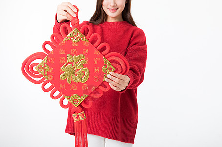 福窗花新年女性拿红色中国结背景