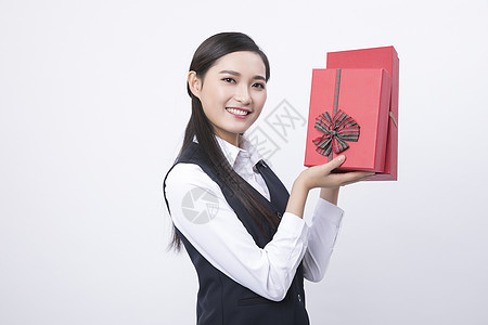 手拿礼物盒的职业女性高清图片