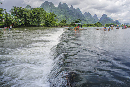 遇龙河晨霞遇龙河竹筏漂流背景