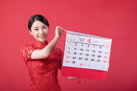 4月日历新春手持日历的东方美女背景