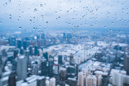 大雪城市上海雨雪天气城市建筑全景背景