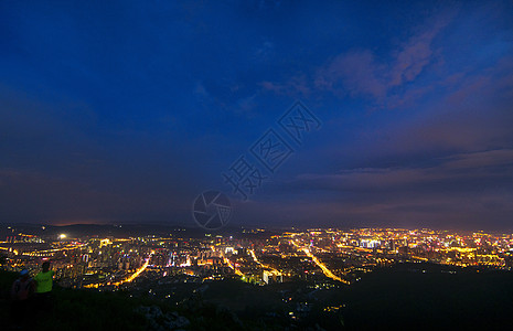 粒子光斑昆明新城城市夜景背景