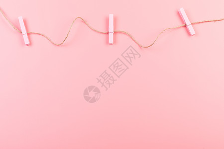 粉色夹子创意纯色背景背景图片