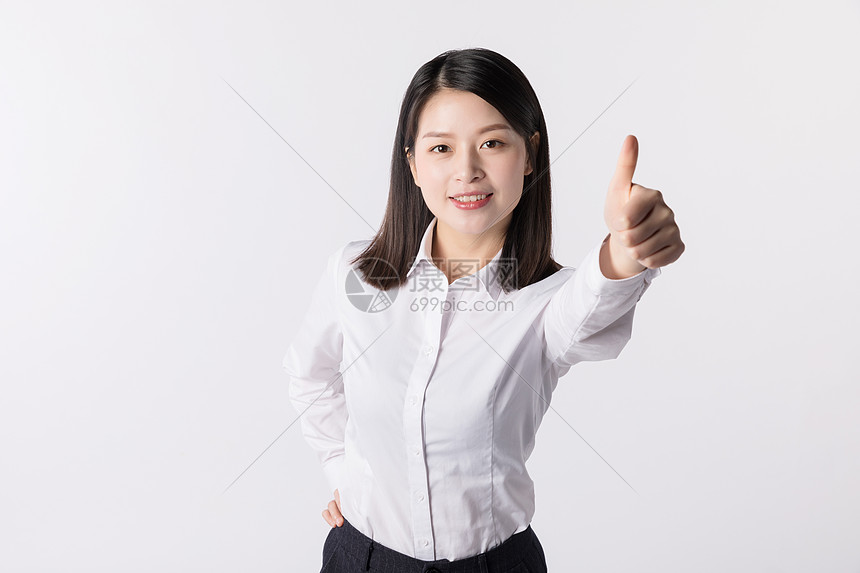 商务女性白领竖大拇指点赞图片