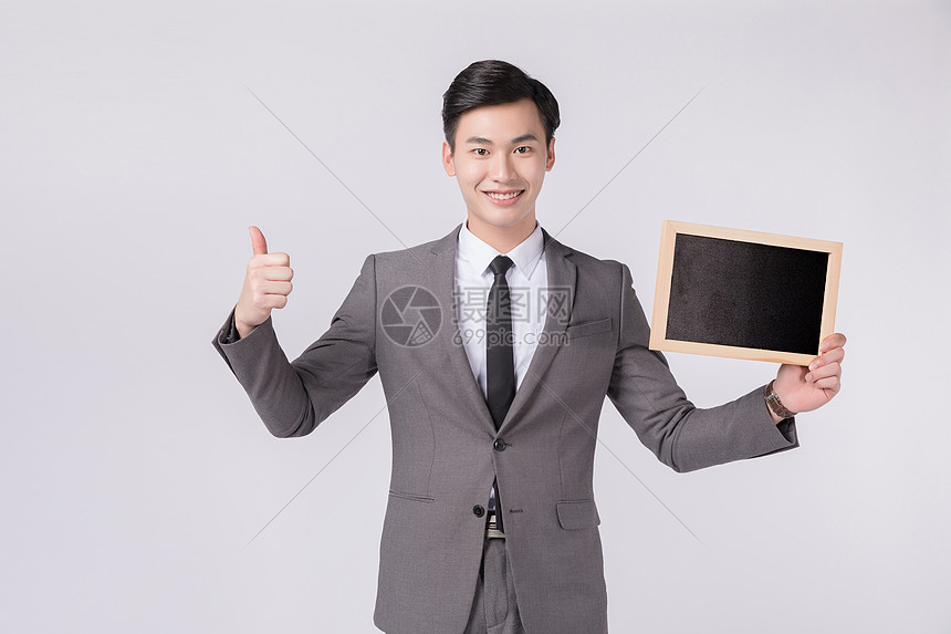 双手点赞竖大拇指的商务男性形象图片