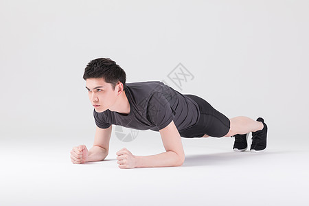 健身运动男性做平板支撑背景图片
