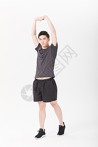 男性健身肢体拉伸热身动作背景图片