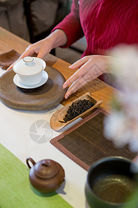 老白茶中国传统女性茶艺师煮茶照片背景