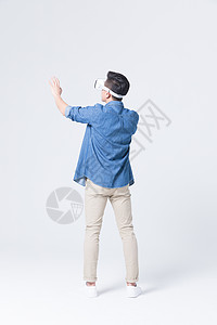 3D科技背景年轻男性体验虚拟现实3D眼镜背景