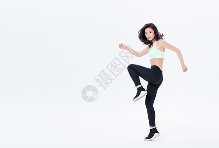 年轻女性运动女性高抬腿动作背景