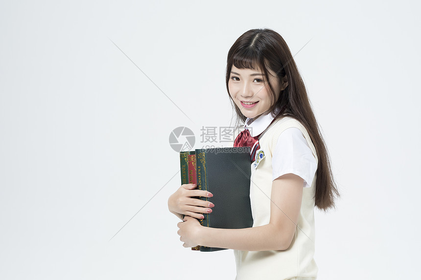 拿着书本的女学生图片