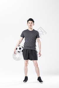 健身男模拿着足球的运动男性背景