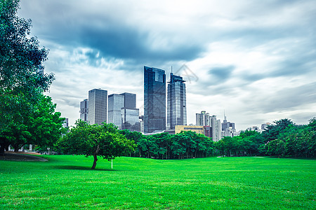 蓝天白云草地建筑城市建筑背景背景