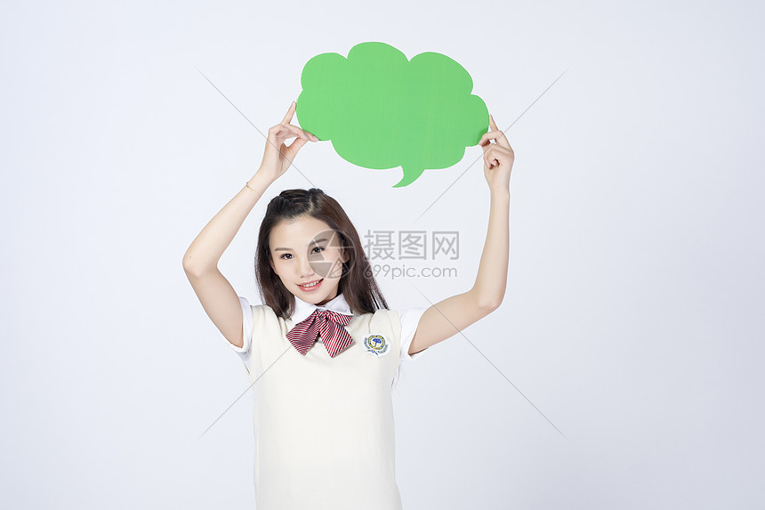 拿着对话框的女学生图片