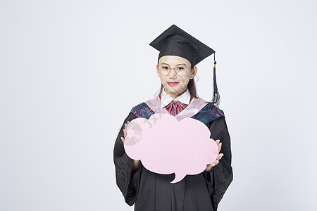 拿着文字框的毕业女学生图片