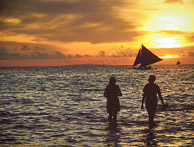 海浪帆船厦门海边日落背景