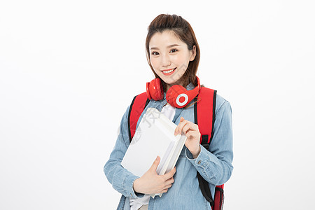 背书包戴耳机的女大学生高清图片