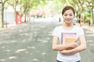 青春大学生抱着书本图片