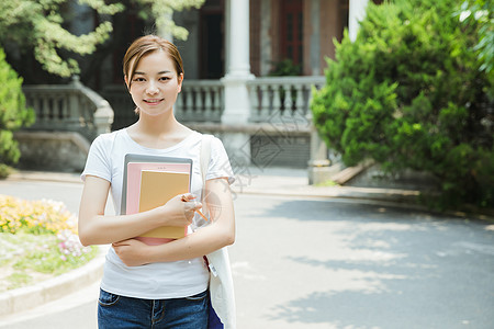 青春大学生抱着书本图片