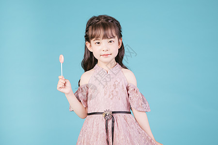 粉色儿童海报儿童节小女孩儿童手持棒棒糖背景