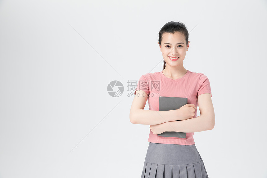 活力青年女性书本学习图片