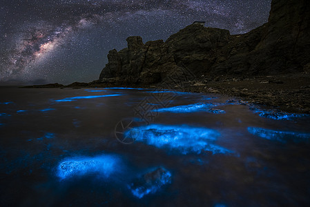 星空大海大连荧光海礁石星空背景