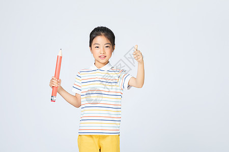 儿童教育拿铅笔的女孩背景图片