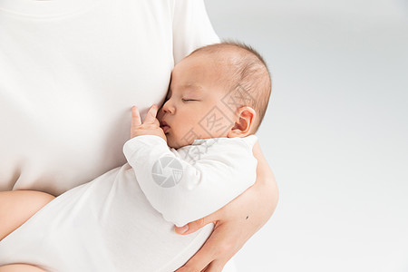 抱着孩子的女人母婴妈妈抱着宝宝睡觉背景