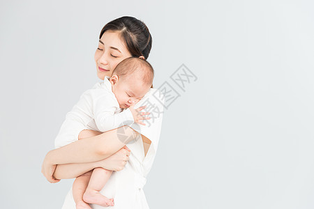 宝宝起床母婴妈妈抱着宝宝睡觉背景