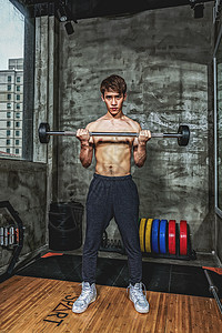 健身房强壮男性杠铃运动背景图片