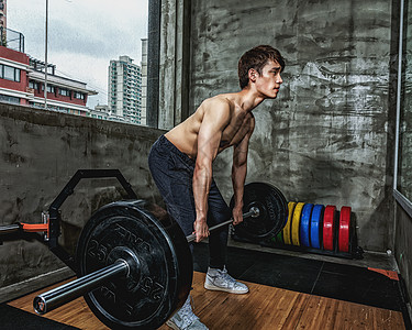 健身房强壮男性杠铃运动背景图片