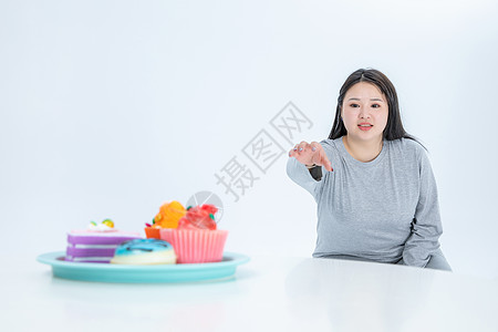 胖女生与甜食图片