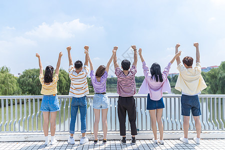 双手高举大学生高举双手背景