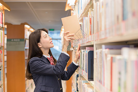 图书馆美女学生图书馆看书背景