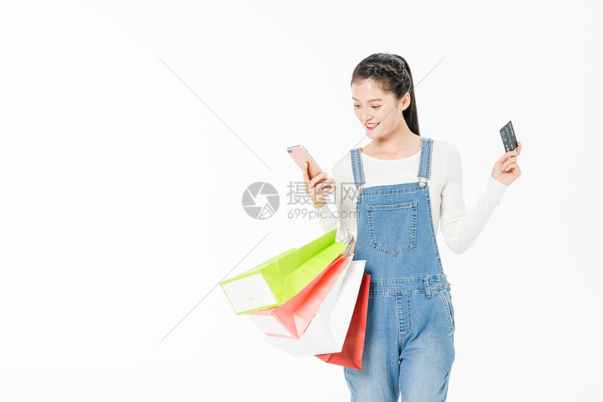年轻女性购物手机移动支付图片