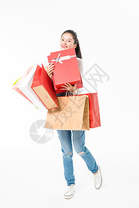 年轻女性青春大学生购物抱礼盒背景