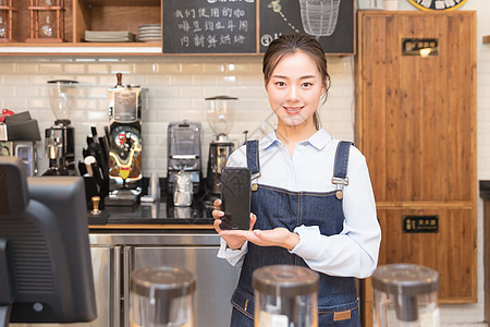 咖啡馆服务员手机支付女性高清图片素材